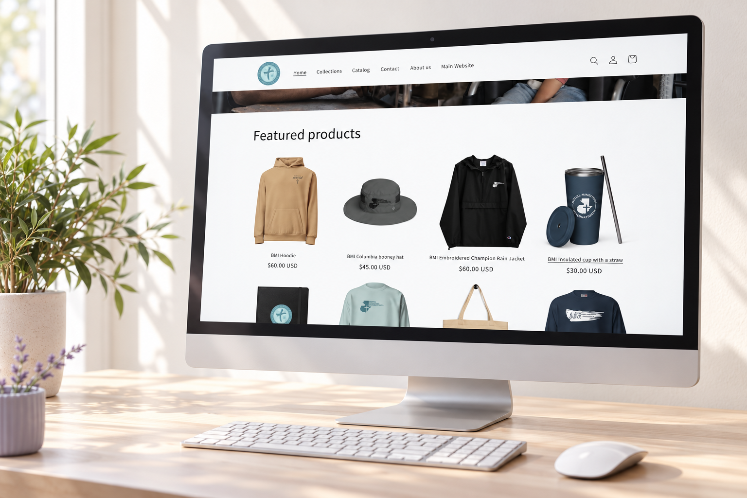 Bethel Merch website displayed on a desktop monitor in an illustrative workspace mockup